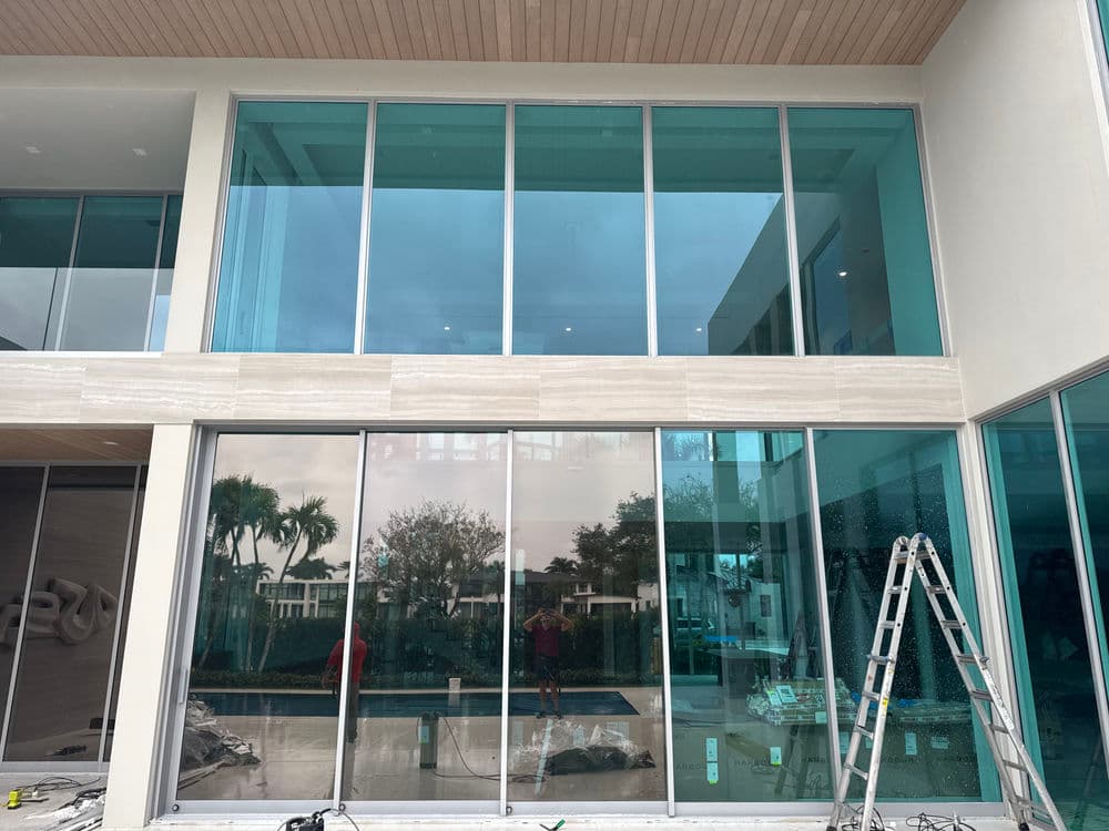 Modern glass windows in a contemporary home showcasing outdoor views and sleek design.